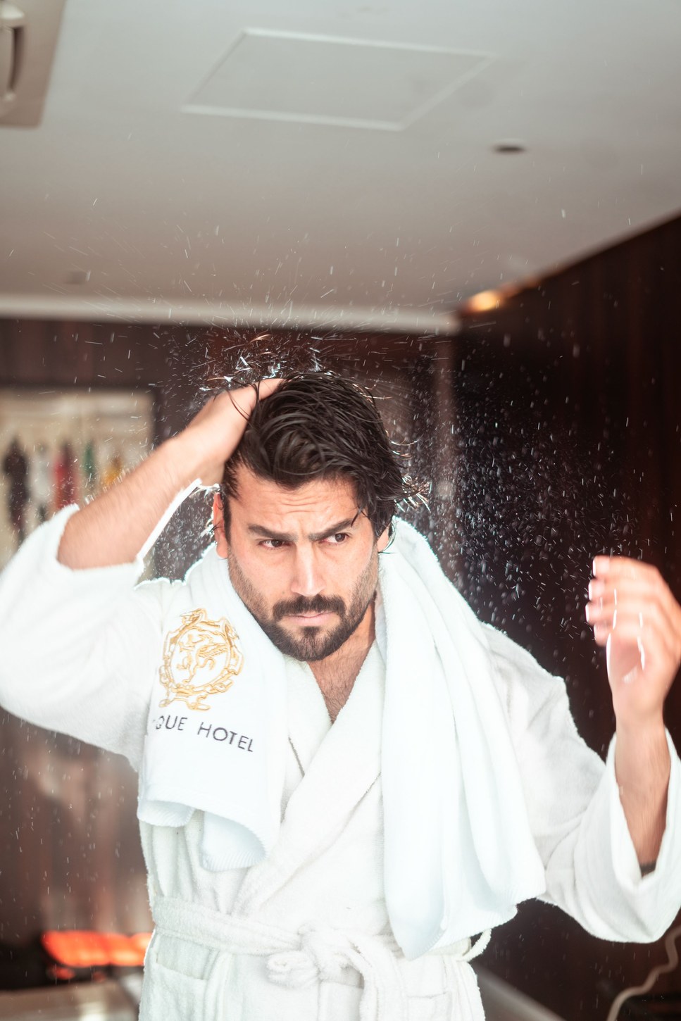 Man grooming in a hotel bathroom after a long travel day