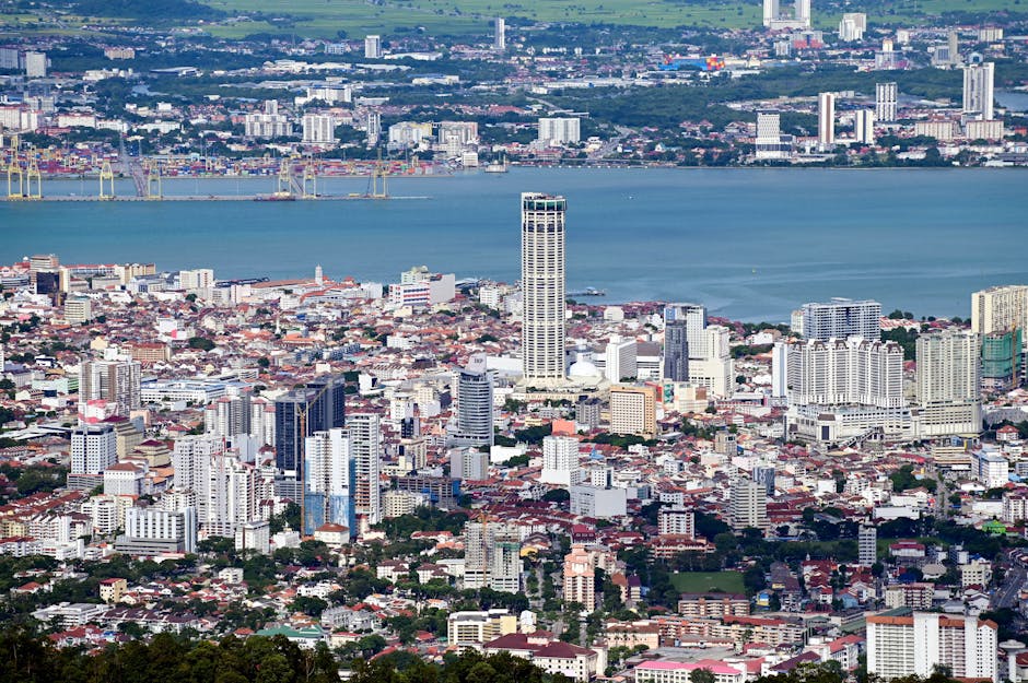 A stunning aerial view of George Town, Penang showcasing the urban landscape and coastal beauty.